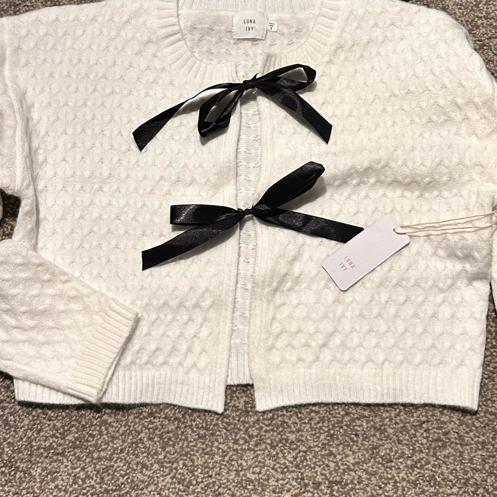 White Sweater with Black Bow Accents